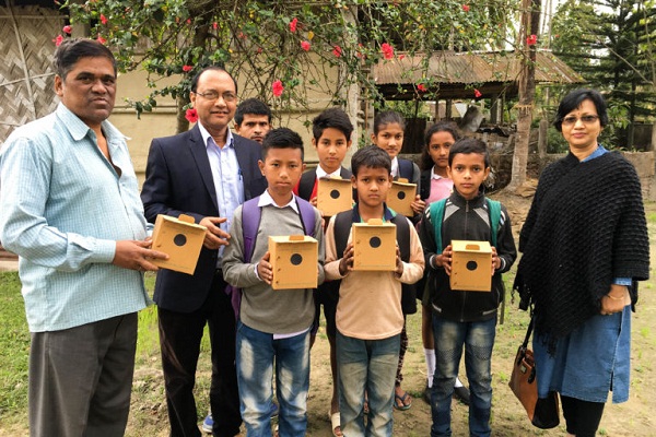 School children of Borbali Samua village, Assam, with Jayanta Neog (left) and Prabal Saikia.