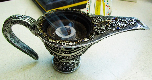 Agarwood chips burnt over charcoal as incense