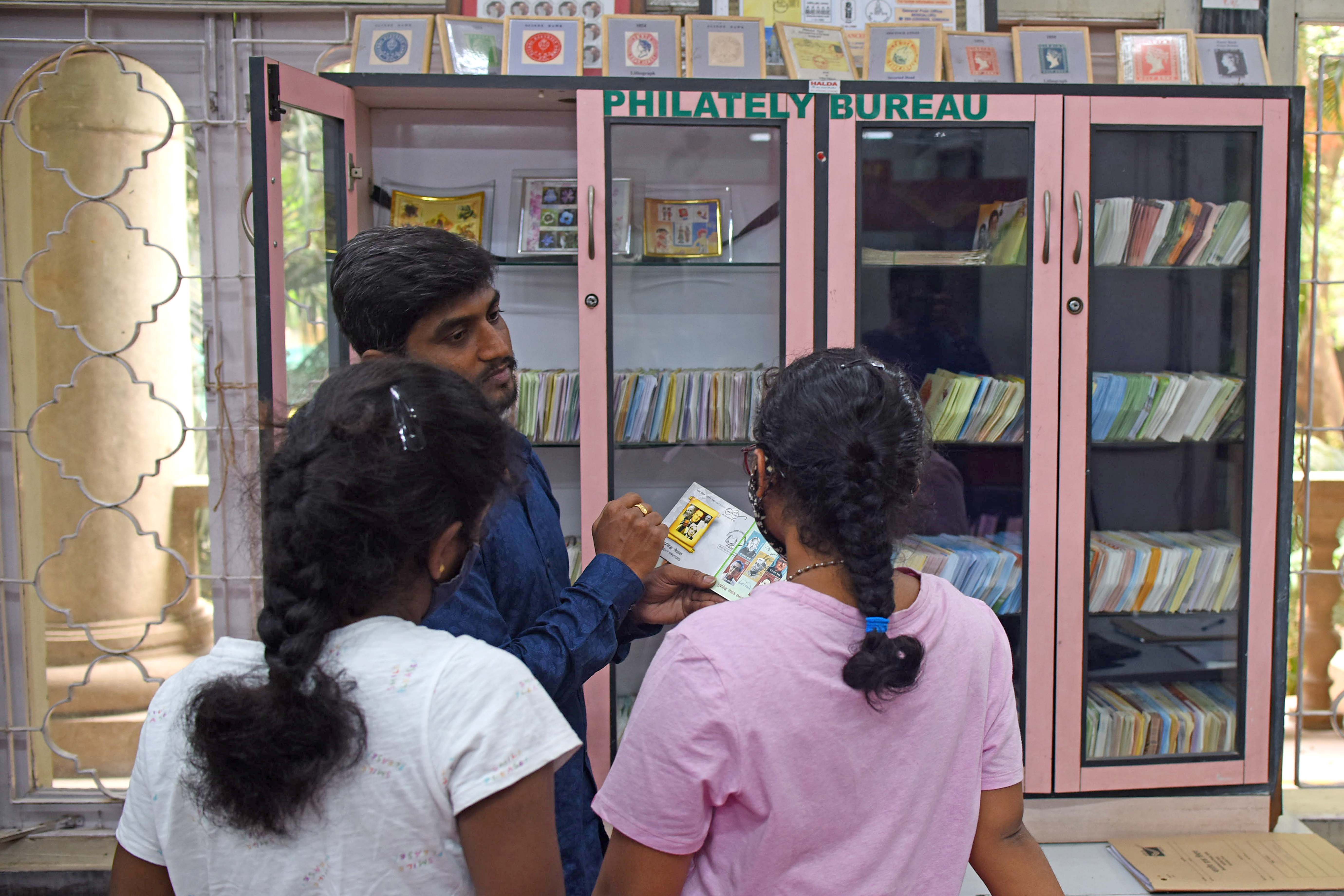 While some might say that mails and stamps are a thing of the past, these youngsters for sure have a passion for philately (collection and study of postage stamps). Credit: DH Photo