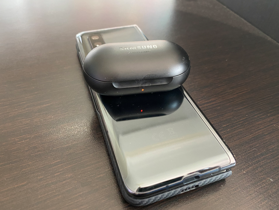 Samsung AKG earbuds pod getting wirelessly charged on the back of the Galaxy Fold (DH Photo/Rohit KVN)