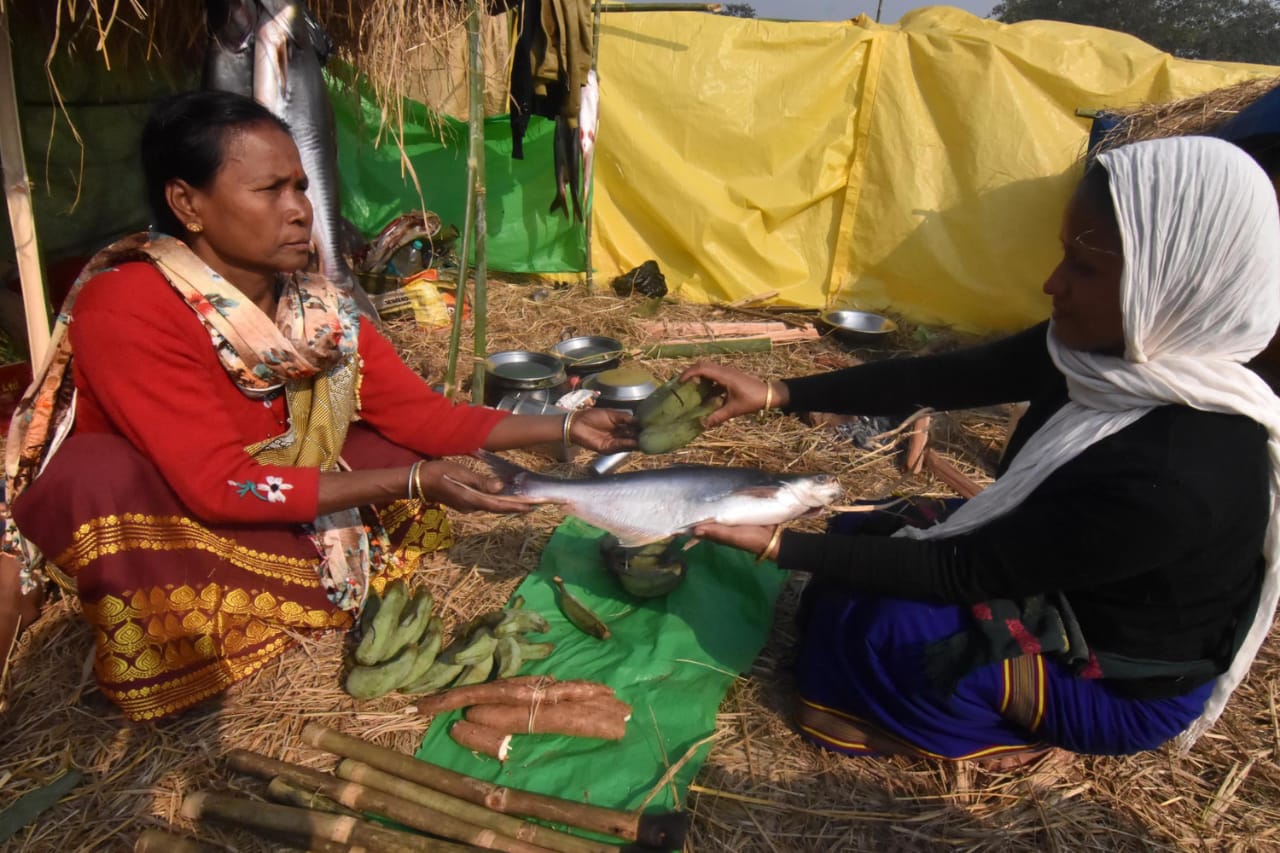 Women exchange fish and ginger in Jonbeel Mela in Morigaon district on Saturday. (Photo by Anuwar Hazarika/Morigaon)
