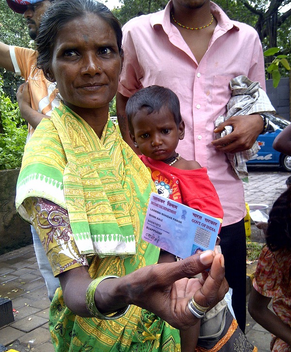 Laxmibai Pawar displaying her PAN card, which is of little practical use for her