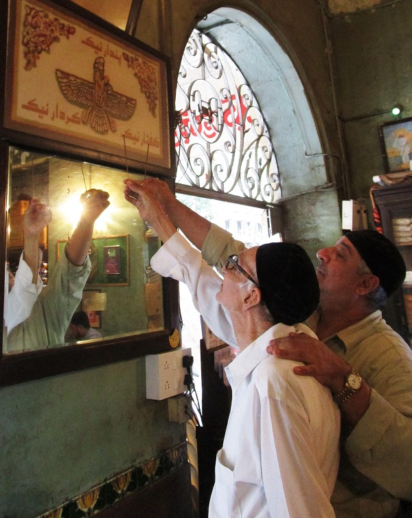 Senior Zoroastrian late Aqa Boman Kohinoor and his son Afshin pray with benzoinincense. PHOTOS BY AUTHOR
