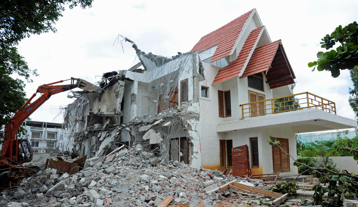 Demolition of a villa at Shubh Enclave in Kasavanahalli, in 2016. Encroachment ofstorm water drain had resulted in severe flooding in this area. (DH Photo/ Ranju P)