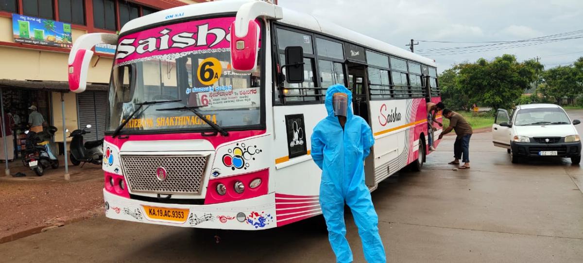 2 bus conductors wear safety gear
