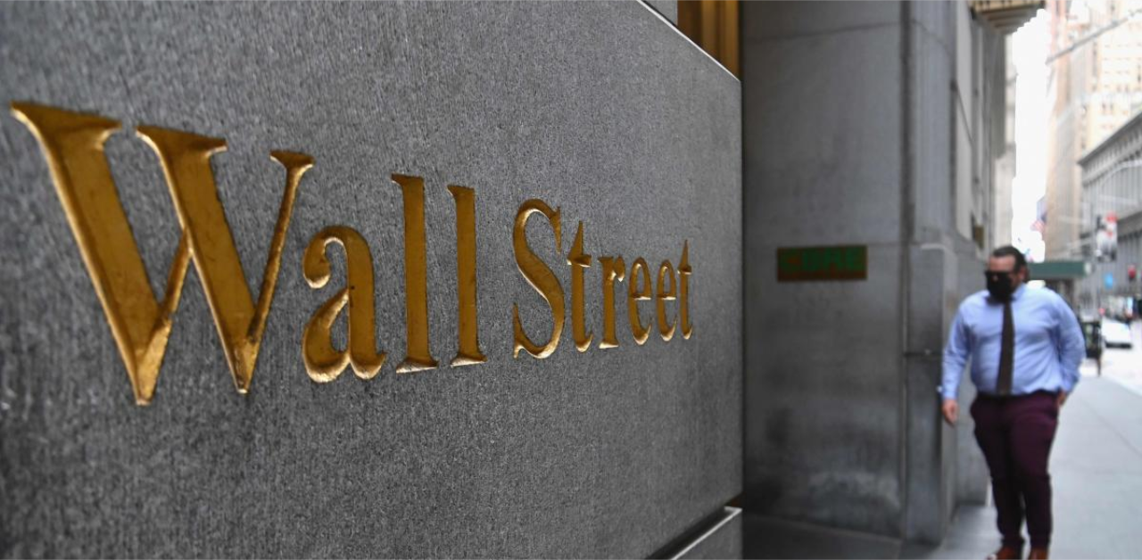 Nasdaq hits correction, Dow advances as US stimulus bill nears finish line