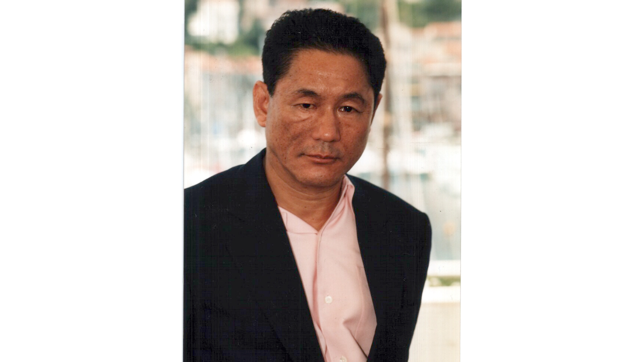 Vehicle carrying noted Japanese director Takeshi Kitano attacked with pickaxe