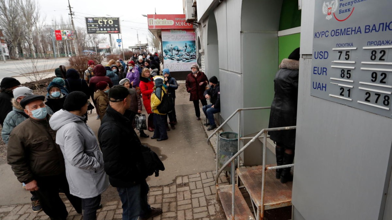 Ukraine limits cash withdrawals, bans forex purchases as Russia invades