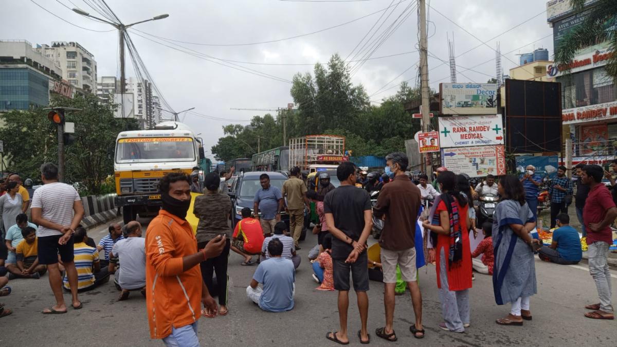 Bengaluru residents use tractors to get into flooded layout