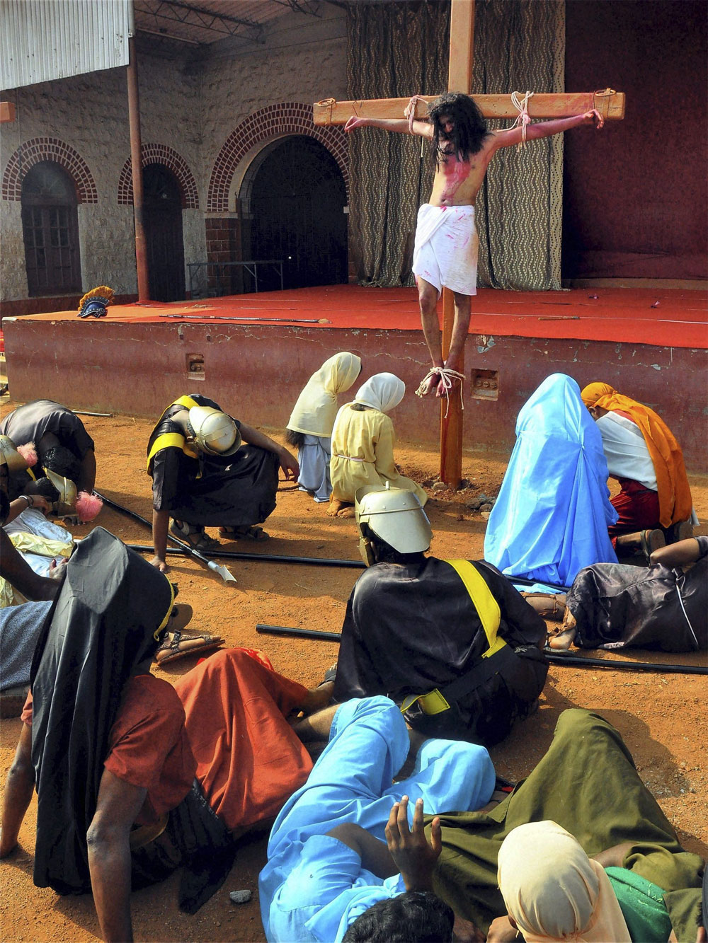 Devotees enaction crucifixion of Lord Jesus on the occasion of Good Friday in Hubli. 