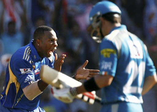 Mumbai Indians bowler K Pollard (L) celebrates the wicket of Ferguson of Pune Warriors during their IPL T20 match in Mumbai on Friday. PTI Photo by Shashank Parade
