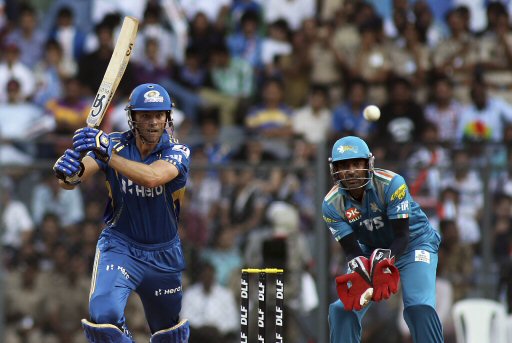 Mumbai Indians players Dinesh Karthik bats during an Indian Premier League (IPL) cricket match against Pune Warriors in Mumbai, India, Friday, April 6, 2012. (AP Photo/ Rajanish Kakade)