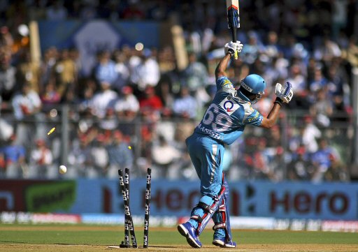 The bails fly off the wickets to dismiss Pune Warriors Manish Pandey  during Indian Premier League (IPL) cricket match against Mumbai Indians  in Mumbai, India, Friday, April 6, 2012. (AP Photo/Rajanish Kakade)