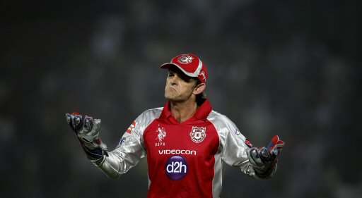 Kings XI Punjab's Adam Gilchrist reacts to his bowler James Faulkner,