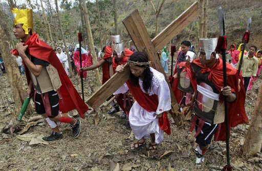A devotee enacts the crucifixion of Jesus Christ to mark Good Friday in Gauhati, India, Friday, April 6, 2012. Christians around the world are marking the Easter holy week. (AP Photo/Anupam Nath)