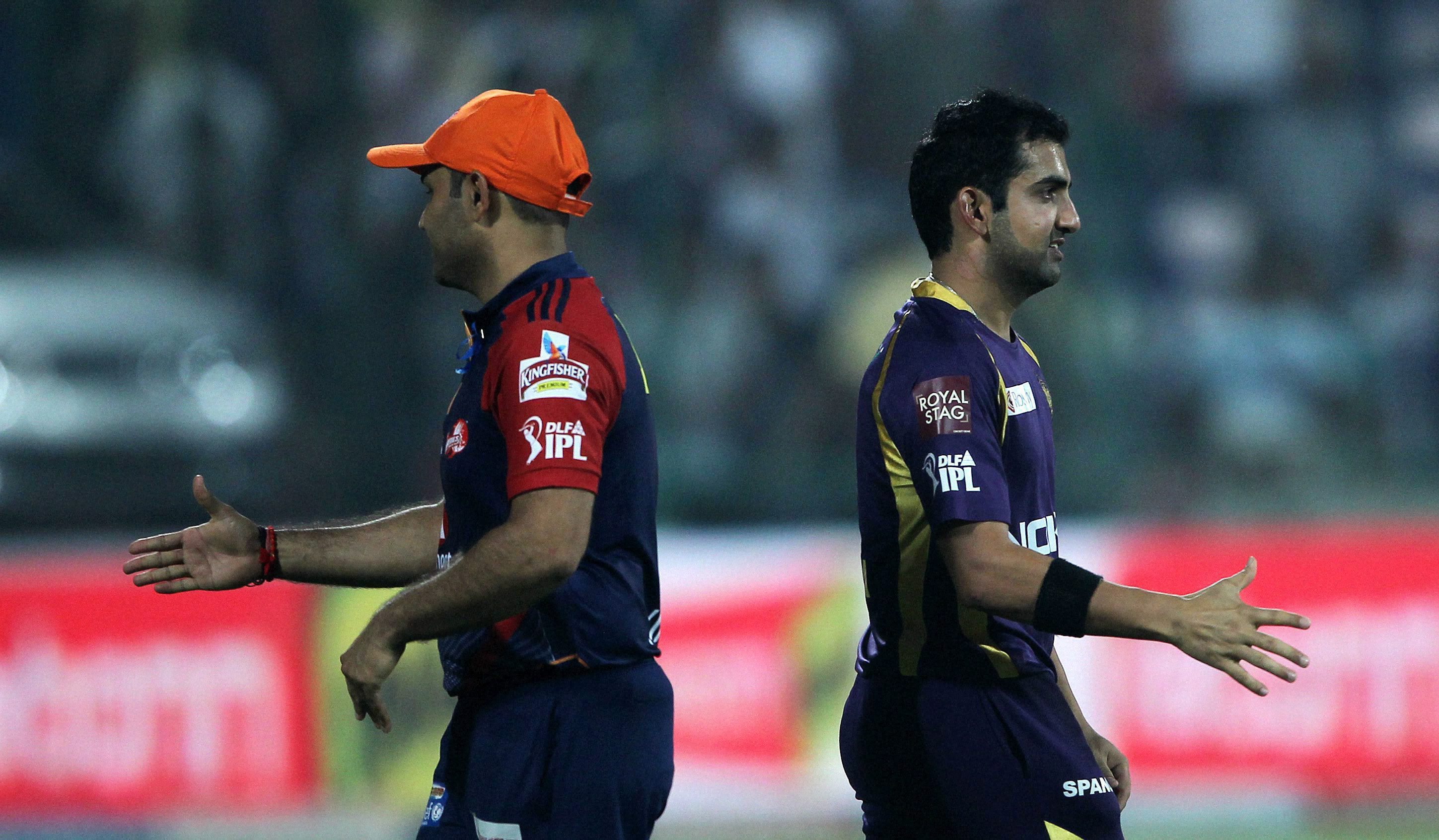 New Delhi : Delhi Daredevils' Virender Sehwag and Kolkata Knight Riders'  Gautam Gambhir after their IPL-5 match in New Delhi on Monday. PTI  Photo by Aman Sharma