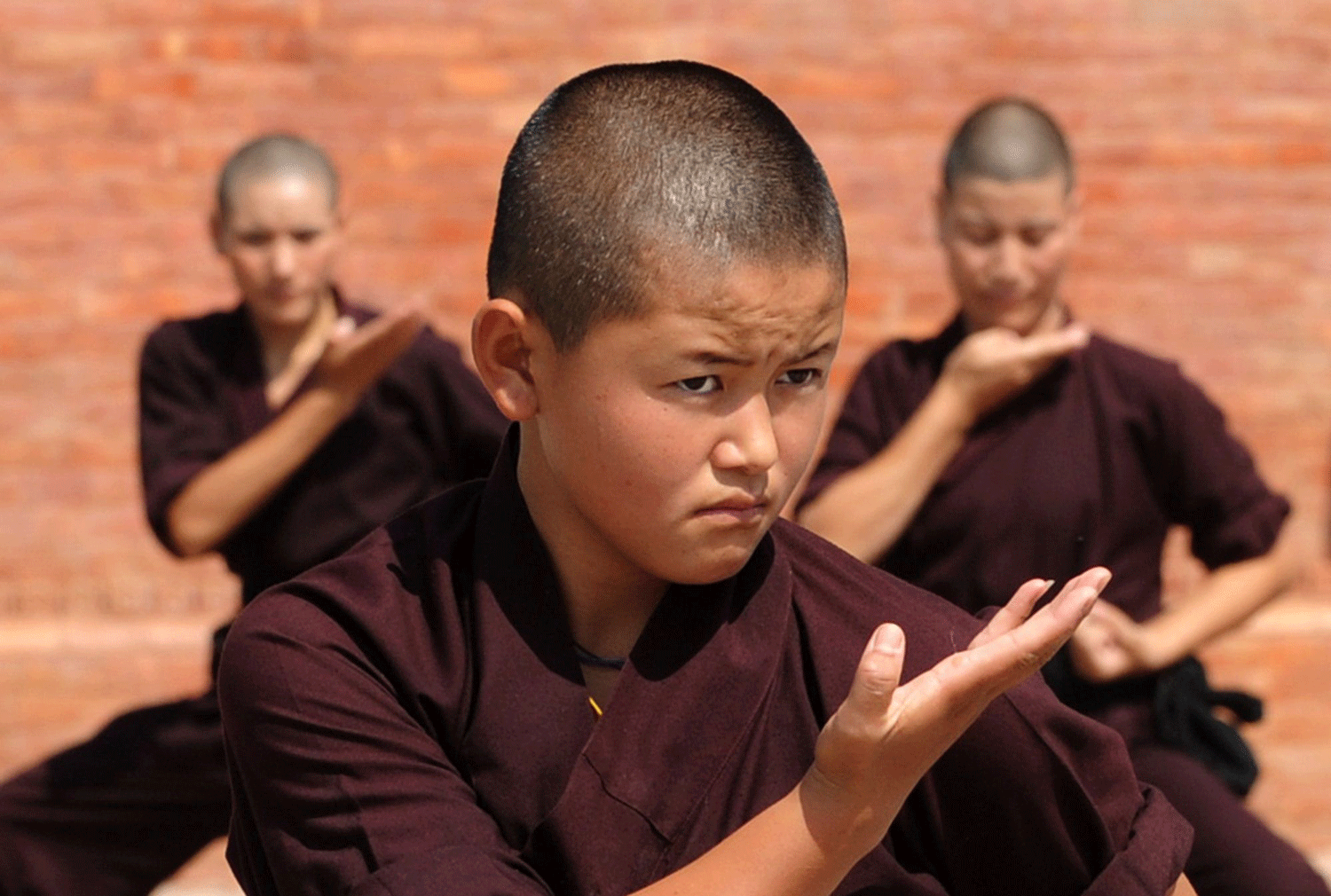 Buddhist nuns practise Kung-fu at the Amitabha Drukpa Nunnery on the outskirts of Kathmandu.  AFP