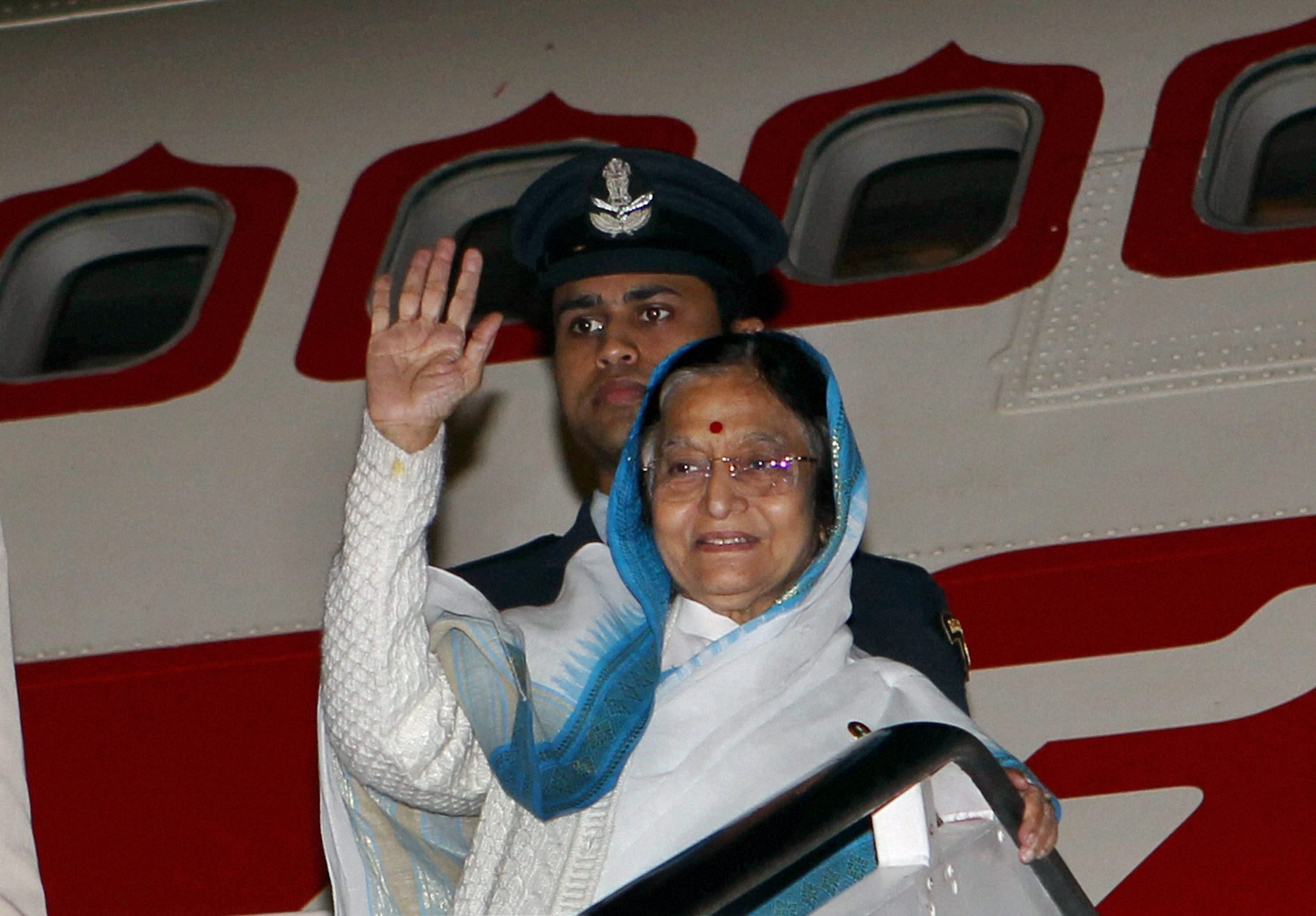 President Pratibha Devisingh waves as she prepares to depart for Delhi from the airport in Durban on Monday after the end of her state visits to Seychelles and South Africa. PTI