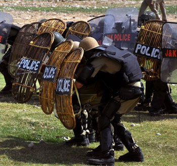 Jammu: Jammu and Kashmir police officers during a special training at the Sujwan police training camp in Jammu on Tuesday. The police officers were taught new techniques to handle unruly mobs without using any lethal weapons during a special training...