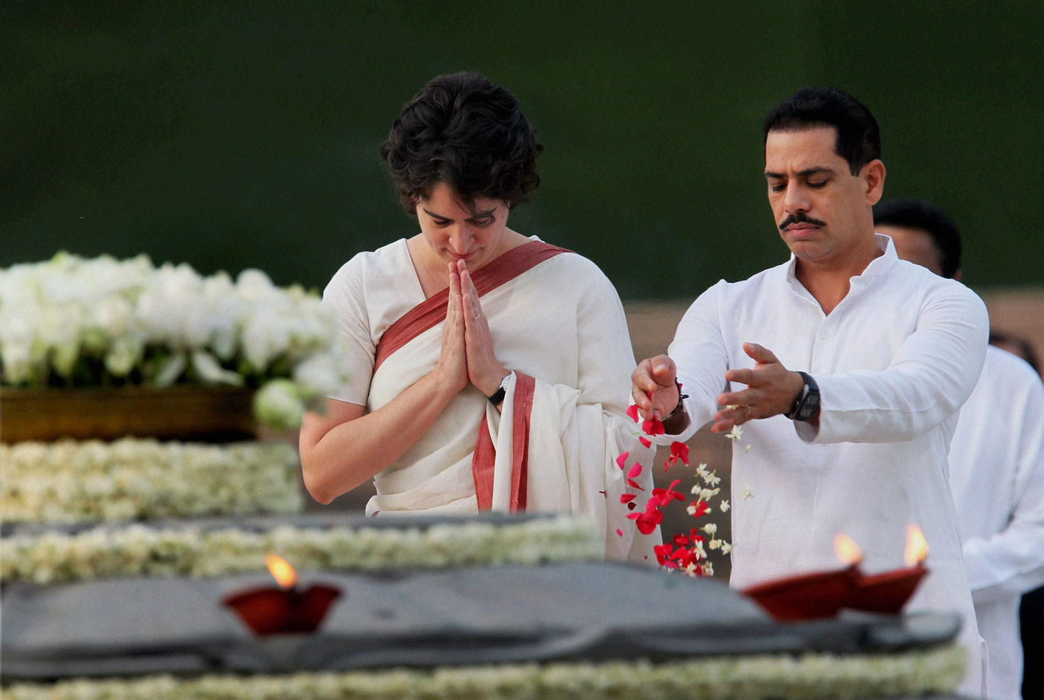 Priyanka Vadra with her husband Robert Vadra paying tribute to former Prime  Minister Rajiv Gandhi on his 21st death anniversary at Vir Bhumi in New Delhi on  Monday. PTI