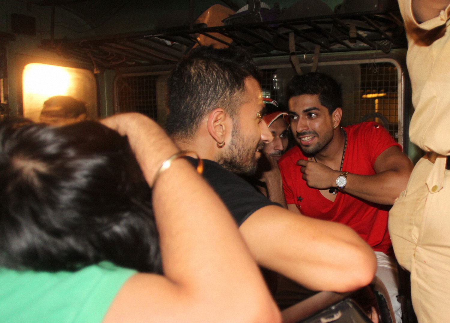 Rave party youths arrested by police taken back in a police van after being tested at a hospital in Mumbai on Sunday night. PTI