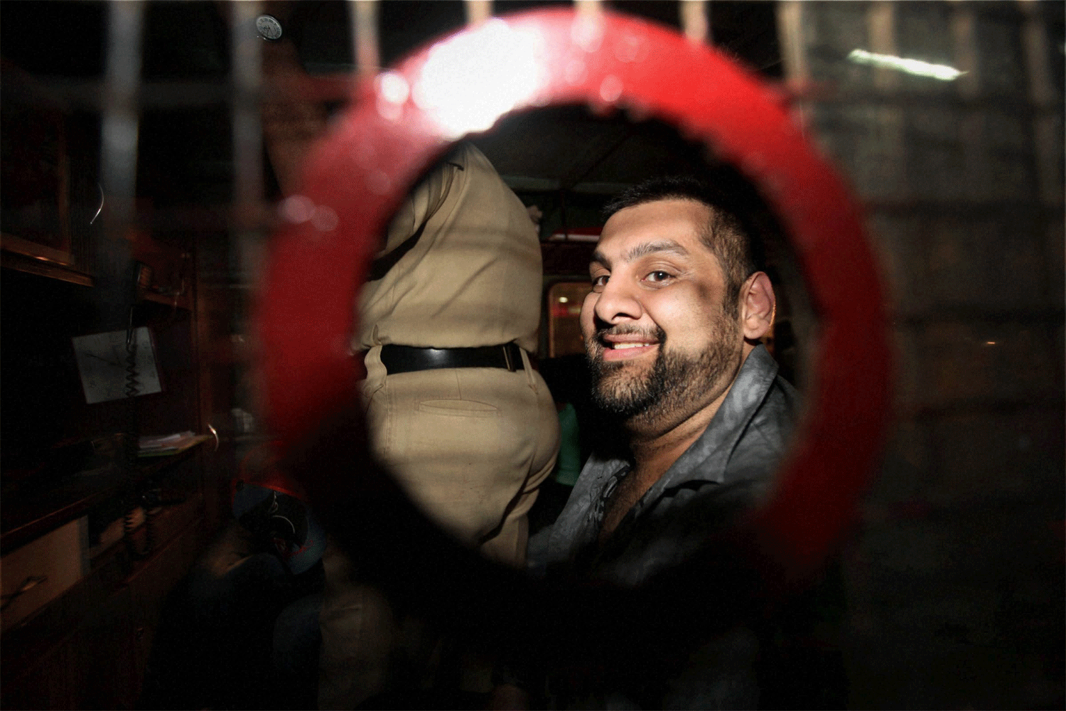 One of the persons who were detained by the police during a raid at a rave party in Mumbai on Sunday night. PTI Photo