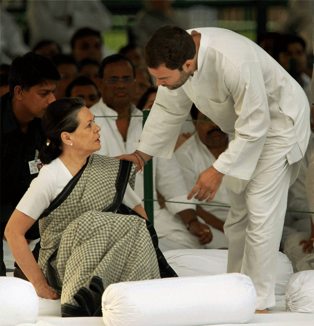 UPA Chairperson Sonia Gandhi and AICC General Secretary Rahul Gandhi after paying tributes to former Prime Minister Rajiv Gandhi on his 21st death anniversary at Vir Bhumi in New Delhi on Monday. PTI Photo