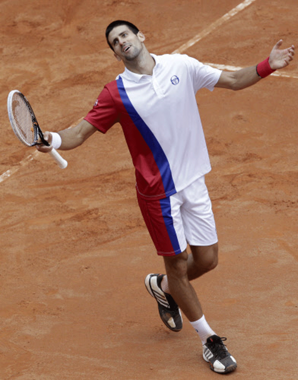 Serbia's Novak Djokovic reacts after missing a point against Spain's Rafael Nadal during their final match at the Italian Open tennis tournament, in Rome, Monday, May 21, 2012.