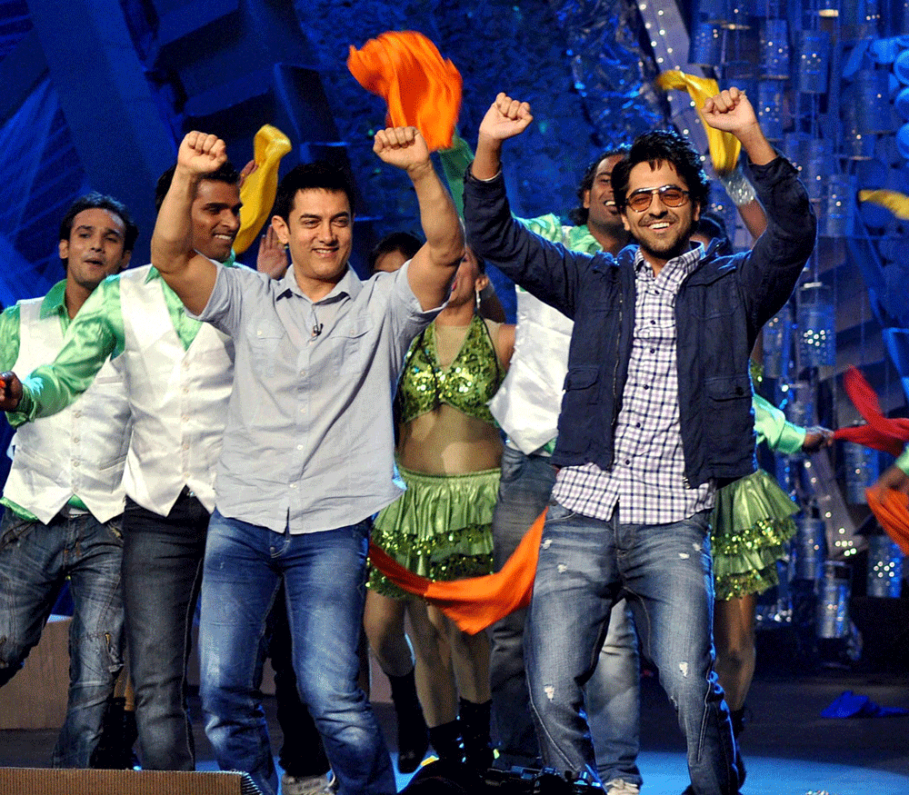 Bollywood actors Aamir Khan and Ayushmann Khurrana perform at the 4th edition of NDTV Greeenathon in Mumbai on Sunday.