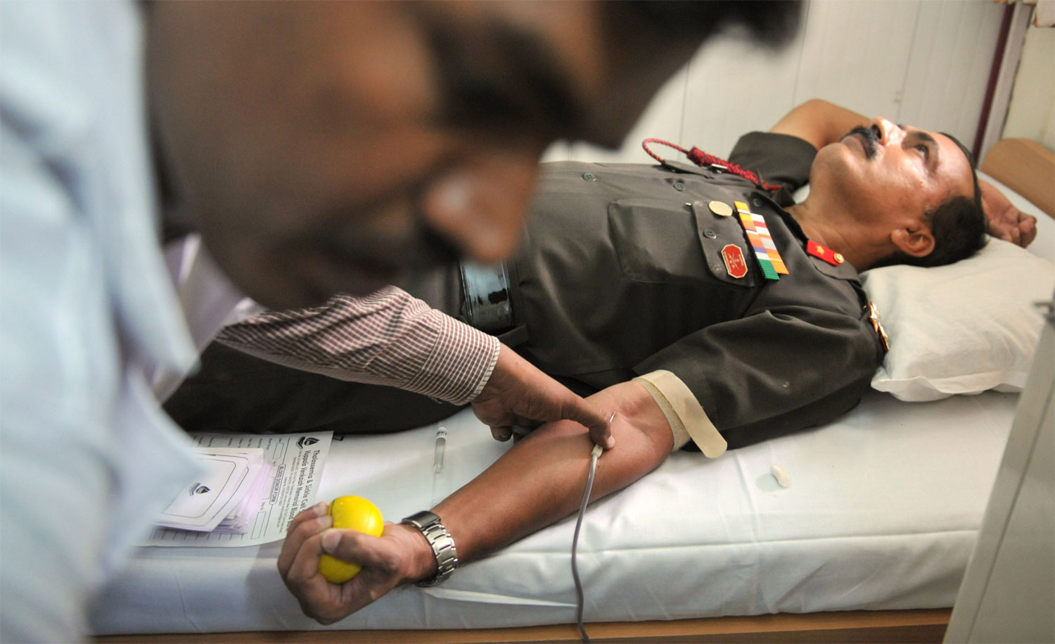 Indian Army Artillery Centre Brigadier, Prakash S.Nair, donates blood at a donation camp in Hyderabad on August 4, 2012. India’s blood requirement are about six million units per year but blood banks are able to collect only about three million uni...