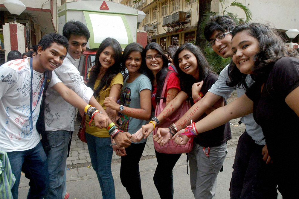 College students showing friendship bands as they celebrate Friendship Day in Mumbai on Saturday. PTI 