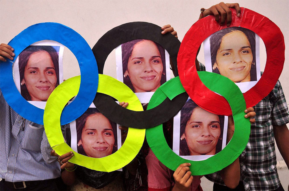  School children celebrate Badminton player Saina Nehwal's bronze medal in Olympic Games, in Moradabad on Saturday. PTI
