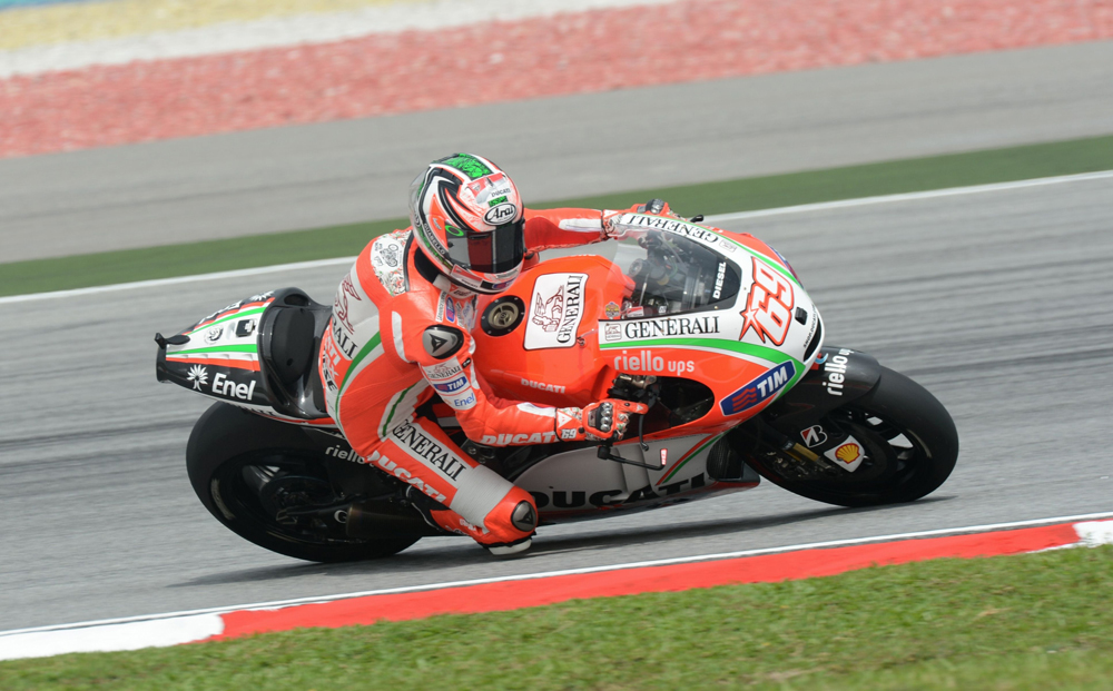 Ducati rider Nicky Hayden of the US speeds around the corner during the first practice session of the Malaysian Grand Prix MotoGP motorcycling race at the Sepang circuit on October 19, 2012. AFP PHOTO