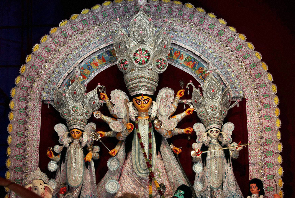 An idol of Devi Durga at a community puja pandal in Kolkata on Friday. PTI