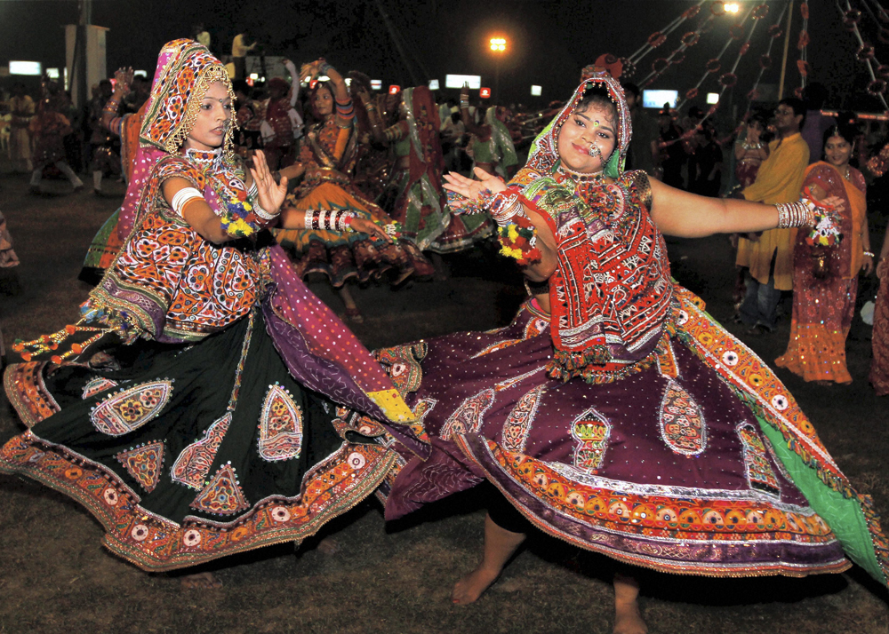 Youngsters take part in a Garba programme during Navratri festival in Ahmedabad on Thursday. PTI