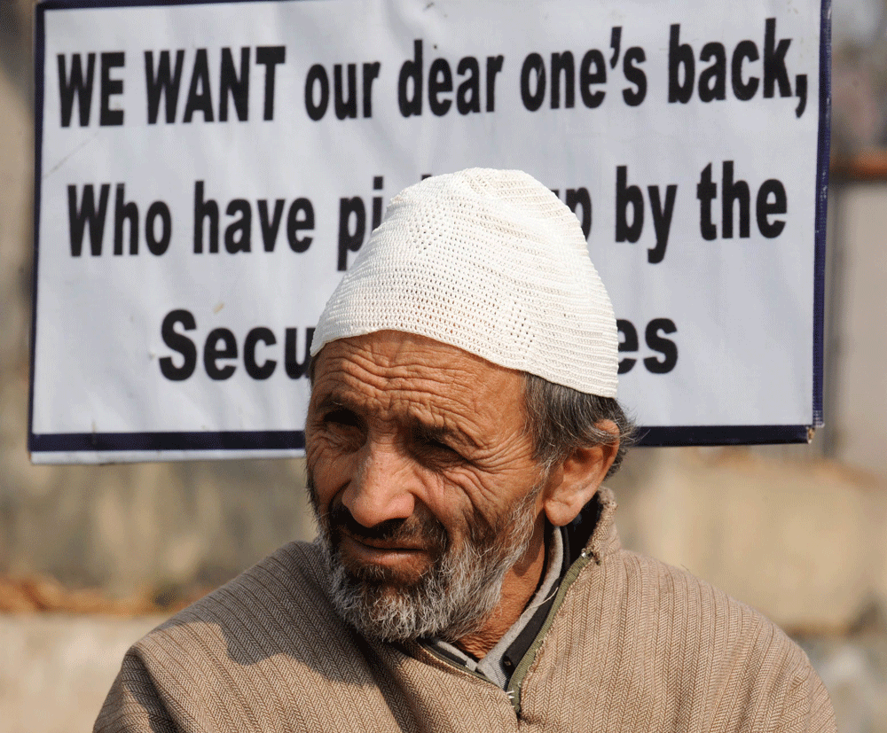 A Kashmiri member of the Association of Parents of Disappeared People ( APDP) sits during an annual protest to demand information of the whereabouts of their missing relatives in Srinagar on November 10, 2012. Rights groups say as many as 8,000 peopl...