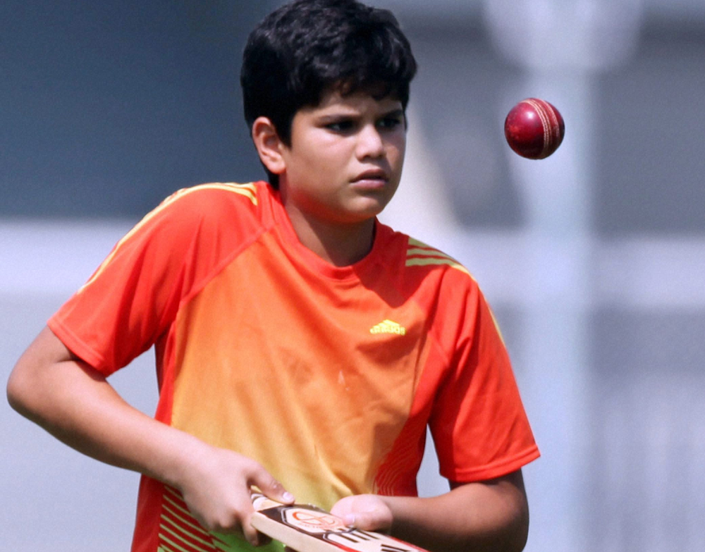 Mumbai: Sachin Tendulkar's son Arjun knocks the ball during Team India's practice session in Mumbai on Saturday. PTI Photo by Santosh Hirlekar