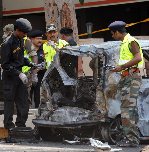 National Security Guards (NSG) team sent by the central, collecting the evidences and samples for their investigation at the spot where the bomb blast incident took place near BJP office, in Bangalore on Thursday. -Photo/ VS
