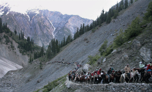Pilgrims on the way to holy Amarnath cave shrine on Thursday. PTI Photo