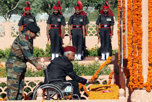 Paraplegic ex-army Maj General S K Razdan, paying homage at the war memorial at Drass on the occasion of 14th anniversary of Kargil War victory on Friday. PTI Photo