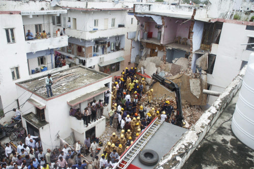 Rescue work is carried out after collapse of a building at Ranip in Ahmedabad, Gujarat on Friday. PTI Photo