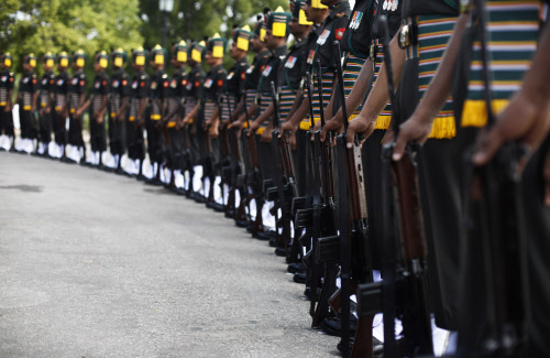 Indian army soldiers pay tribute at India Gate war memorial on the 14th anniversary of India's victory in the Kargil War in New Delhi, India, Friday, July 26, 2013. Friday marked the second day of the two-day celebrations of the 14th anniversary of i...