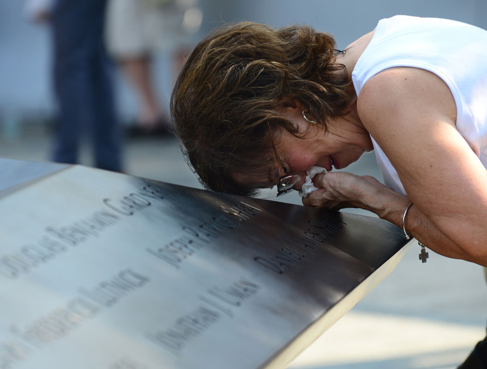 Geraldine Davie of Pelham, N.Y., cries after viewing name of her 23-year-old daughter, Amy O'Doherty, on the wall at the Sept. 11 memorial during the 12th anniversary observance of the 9/11 terrorist attacks on the World Trade Center. O'Doherty was k...