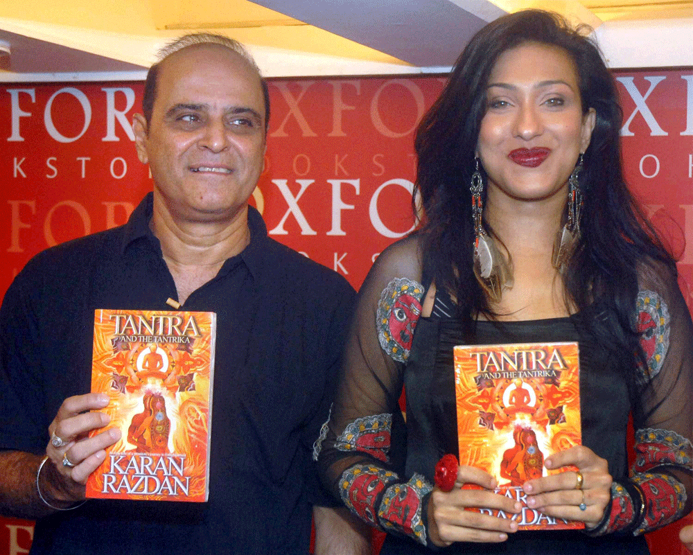 Kolkata: Film actress Rituparna Sengupta with a noted film director and  writer Karan Razdan at a book release function in Kolkata on Tuesday  late evening. PTI Photo(