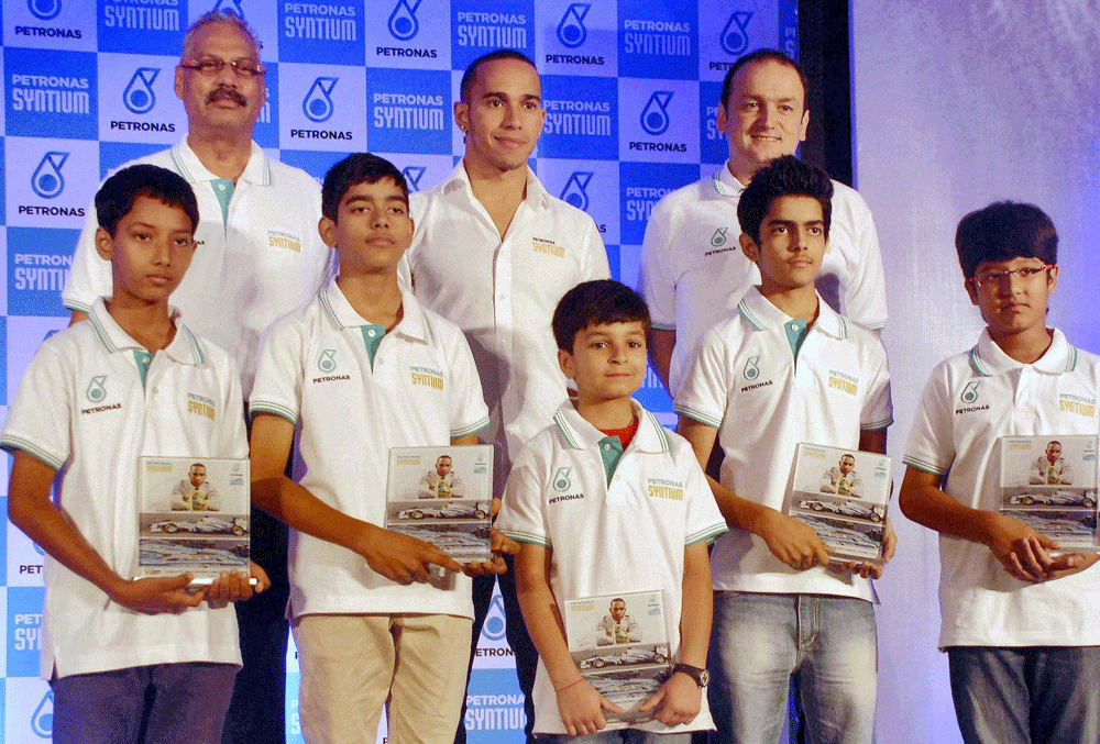 Noida: F1 driver Lewis Hamilton (standing at the centre) at a press conference in Noida on Wednesday. PTI Photo