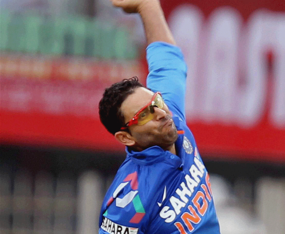 Ranchi: India's Yuvraj Singh bowls against Australia during the 4th ODI cricket match in Ranchi on Wednesday. PTI Photo