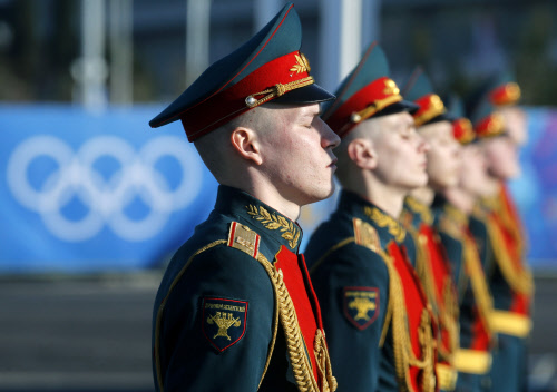 Russian soldiers stand during the welcome ceremony for the Philippine Olympic team in the Athletes Village at Olympic Park ahead of the 2014 Winter Olympics in Sochi, Russia, Sunday, Feb. 2, 2014. The games run from Feb. 7-23. (AP Photo)