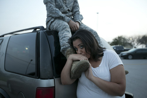 Luci Hamlin and her husband Specialist Timothy Hamlin wait to get back  to their home on base at  Fort Hood, Texas, April 2, 2014. Several  people were killed and at least 14 injured on Wednesday when a gunman  opened fire at a U.S. Army base in Fort...