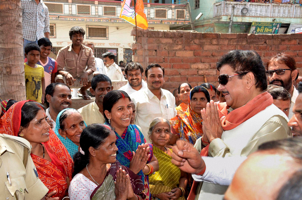 Patna : BJP candidate Shatrughan Sinha meeting women voters during his election campaign in Patna on Thursday. PTI Photo