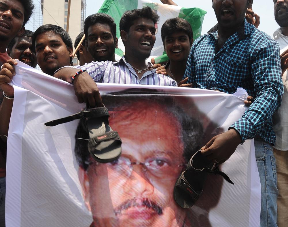 JDS Youth workers staged a protest against KPCC State President G  Parameshwara for his controversial speech on Former P M H D Devegowda,  held in front of JDS Head Office in Bangalore on Thursday. JDS Youth  workers using sandals to beat the poster ...